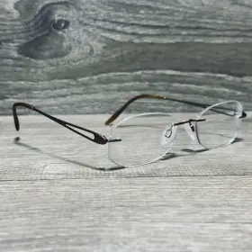 Charmant Ch10934s Eyeglass Frames 52-17-135 Brown Titanium Mens Rimless