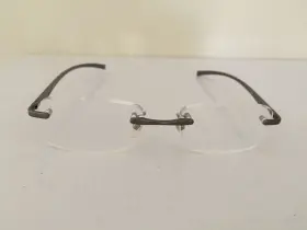 Al12 Foster Grant / Magnivision Eyeglasses Rimless With Lightweight Gunmetal Arm