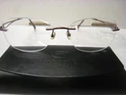 Womans Stepper Eyeglass Frame SI96523 F033 53-16-135-37.5V Wine W/ Case Pre-owned. Price: $29.99.