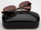 New Coach Hc 7111 900513 3N Shiny Light Gold Sunglasses 57-15-140MM B50MM. Price: $94.99.