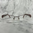 Oleg Cassini OCO318 200 Eyeglasses Half Rim Brown Rectangular Frames 51-18-135 Pre-owned. Price: $17.26.