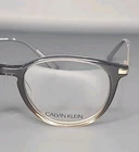 Calvin Klein CK19712 027 Crystal Grey/brown Gradient Eyeglass Frame 51/17/140 New. Price: $62.95.
