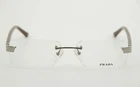 New Prada Frame VPR66L 7JQ-101 53-16 With Case. Price: $99.00.