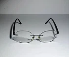 Starck Eyeglasses Frames SH2021 0003 Silver Black Rimless Round 48-20-145 Pre-owned. Price: $89.99.
