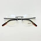 Ermenegildo Zegna Eyeglass Frames EZ5220 002 Matte Black Round Rimless 53-18-145 New. Price: $208.88.