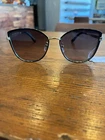 Gucci Women's Sunglasses Gg 0589SK 001 - Black/grey With Gold Temples New. Price: $280.00.