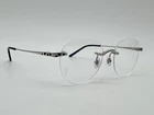 Panthere De Cartier Rimless Silver Eyeglasses CT0309O 002 New 100% Genuine $1250. Price: $775.00.