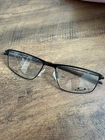 New Oakley Socket OX5019-0156 Satin Black Titanium Eyeglasses Frames 56-17MM. Price: $259.00.
