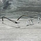 Charmant CH10934S Eyeglass Frames 52-17-135 Brown Titanium Mens Rimless Pre-owned. Price: $34.95.