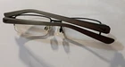 Nike Eyeglasses Frames Only, 8064 002, 52-16-145, Gunmetal Brown Clamshell Pre-owned. Price: $34.00.