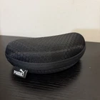 Black Puma Eyeglasses / Sunglasses Case Curved Clamshell Zip Closure Used. Price: $12.00.