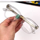 Gucci Women Eyeglasses Grey Clear Gold Demo Square GG0184O 005 New Authentic. Price: $259.96.