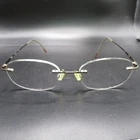 Nikon Titanium NC08 Rimless Eyeglass Frames Lightweight Gold Bronze 140MM Temple New. Price: $37.29.
