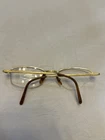 Cartier T8100608 Pale Gold 51MM Titanium Oval Half Rim Unisex Vintage Eyeglasses Pre-owned. Price: $296.65.
