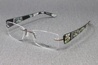 Ed Hardy Women's Eyeglasses Frames EHL814 Bronze 50MM Rimless Skull Flower Print New. Price: $119.99.