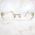 Versace 1080-B 1151 Rectangular Oval Rimless Eyeglasses Crystal Gold 52-16-130 Pre-owned. Price: $123.74.