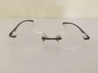 Foster Grant Magnivision AL12 Eyeglasses Rimless With Lightweight Gunmetal Arm Pre-owned. Price: $12.00.