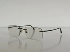 Ray Ban Rb 8501 1000 Titanio Rimless Gunmetal Eyeglasses Frame Only 50-17-135 Pre-owned. Price: $49.99.